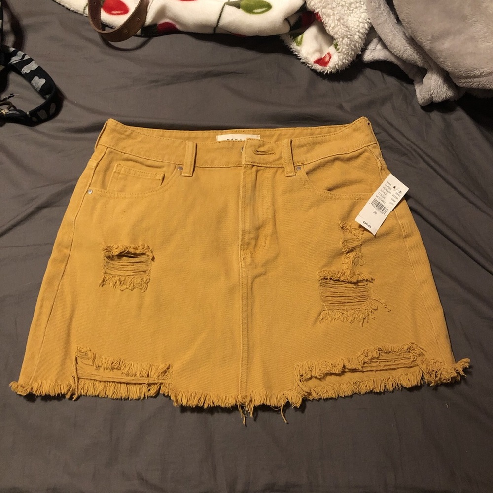 Distressed mustard mini skirt